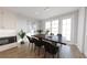 Stylish dining area featuring a modern table, chic chairs, and ample natural light at 439 Mezzo Ln # 88, Alpharetta, GA 30009