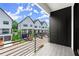 Balcony view of modern townhomes featuring black and white exteriors at 654 Soul Aly # 102, Alpharetta, GA 30009