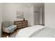 Cozy bedroom featuring a stylish dresser and soothing color palette at 654 Soul Aly # 102, Alpharetta, GA 30009