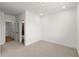 Spacious bedroom with carpet flooring and access to bathroom at 654 Soul Aly # 102, Alpharetta, GA 30009
