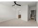 Comfortable bedroom with neutral carpet and an ensuite bathroom and hallway access at 654 Soul Aly # 102, Alpharetta, GA 30009