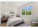 Bright bedroom with natural light, hardwood floors, and neutral decor at 654 Soul Aly # 102, Alpharetta, GA 30009