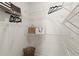 Walk-in closet with ample storage space on white wire shelving with a basket on the floor at 654 Soul Aly # 102, Alpharetta, GA 30009