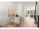 Dining area features a round table with seating for four and overlooks the kitchen at 654 Soul Aly # 102, Alpharetta, GA 30009