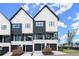 Modern townhomes with black framed windows and balconies at 654 Soul Aly # 102, Alpharetta, GA 30009