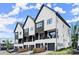 Attractive modern townhomes with black framed windows and balconies at 654 Soul Aly # 102, Alpharetta, GA 30009