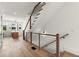 Hallway with hardwood floors and stairs leading to the upper level at 654 Soul Aly # 102, Alpharetta, GA 30009