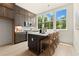 Bright kitchen with stainless steel appliances, island with seating, and ample storage at 654 Soul Aly # 102, Alpharetta, GA 30009