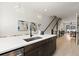 Kitchen island features a white countertop and stainless steel dishwasher at 654 Soul Aly # 102, Alpharetta, GA 30009