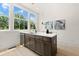 Kitchen island offers additional counter space and storage and overlooks the trees at 654 Soul Aly # 102, Alpharetta, GA 30009