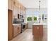 Modern kitchen with stainless steel appliances, an island, and plenty of natural light at 654 Soul Aly # 102, Alpharetta, GA 30009