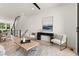 Open-concept living and dining area with hardwood floors, contemporary decor, and plenty of natural light at 654 Soul Aly # 102, Alpharetta, GA 30009