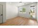Office space with hardwood floors, neutral walls, and a door leading outside at 654 Soul Aly # 102, Alpharetta, GA 30009