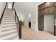 Open staircase leads to the upper level, complemented by the nearby kitchen and dining area at 654 Soul Aly # 102, Alpharetta, GA 30009