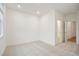 This bright bedroom with neutral carpet offers ample space and natural light at 654 Soul Aly # 102, Alpharetta, GA 30009