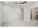 Spacious bedroom with carpet, neutral color, ceiling fan and access to a walk-in closet at 654 Soul Aly # 102, Alpharetta, GA 30009