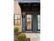 Modern home features black brick, wood accents, and a stylish front door with sidelights at 654 Soul Aly # 102, Alpharetta, GA 30009