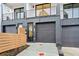 Street view of modern townhomes with private garages, sleek design, and fenced yards at 654 Soul Aly # 102, Alpharetta, GA 30009