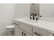 Bathroom features a white vanity, a toilet, and a large mirror at 673 Soul Aly # 146, Alpharetta, GA 30009