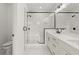 Modern bathroom featuring marble-like tiling and matte black hardware throughout at 673 Soul Aly # 146, Alpharetta, GA 30009