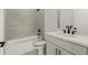 Stylish bathroom featuring a white vanity, modern fixtures, and tiled shower at 673 Soul Aly # 146, Alpharetta, GA 30009