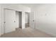 Small bedroom features neutral walls and carpet, and a closet with sliding doors at 673 Soul Aly # 146, Alpharetta, GA 30009