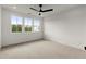 Bright bedroom with plush carpeting, recessed lighting, and large windows offering scenic views at 673 Soul Aly # 146, Alpharetta, GA 30009