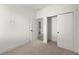 Small bedroom features neutral walls and carpet, with closet and bathroom at 673 Soul Aly # 146, Alpharetta, GA 30009