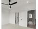 Bright bedroom with a ceiling fan and views to hallway and bath with marble shower at 673 Soul Aly # 146, Alpharetta, GA 30009