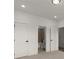 Bedroom featuring bathroom access and neutral-colored carpet at 673 Soul Aly # 146, Alpharetta, GA 30009