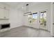Bright dining room with modern lighting and a view to the exterior at 673 Soul Aly # 146, Alpharetta, GA 30009