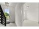 Bright entryway featuring staircase and open doorway leading to another room at 673 Soul Aly # 146, Alpharetta, GA 30009