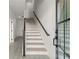 Inviting entryway features a staircase with dark wood and modern railings at 673 Soul Aly # 146, Alpharetta, GA 30009