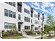 Modern townhome exteriors showcase stylish architecture, black window frames, and landscaped front yards at 673 Soul Aly # 146, Alpharetta, GA 30009