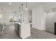 Bright kitchen with an island, modern lighting, stainless steel appliances, and hard surface flooring at 673 Soul Aly # 146, Alpharetta, GA 30009