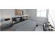 Inviting bedroom featuring a striped comforter, a window, and modern bedside lamps at 673 Soul Aly # 146, Alpharetta, GA 30009