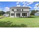 Large backyard features a well-maintained lawn and patio, perfect for outdoor entertaining at 3548 Cedarvale Ct, Powder Springs, GA 30127