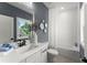 Stylish bathroom featuring a modern vanity, large mirror, and bathtub with subway tile at 3548 Cedarvale Ct, Powder Springs, GA 30127