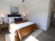 This bedroom is cozy with a comfortable bed, neutral walls, and a bright window at 3548 Cedarvale Ct, Powder Springs, GA 30127