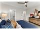 Cozy bedroom featuring a bed with baseball themed decor and stylish modern dresser at 3548 Cedarvale Ct, Powder Springs, GA 30127