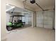 Spacious three car garage with room for vehicle storage and a golf cart at 3548 Cedarvale Ct, Powder Springs, GA 30127