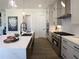 Modern kitchen with stainless steel appliances, a center island, and white subway tile backsplash at 3548 Cedarvale Ct, Powder Springs, GA 30127