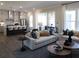 Open-concept living space featuring modern decor, large windows, and seamless integration with the kitchen at 3548 Cedarvale Ct, Powder Springs, GA 30127