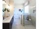 The main bathroom boasts marble tile, a glass shower, and a soaking tub with modern fixtures at 3548 Cedarvale Ct, Powder Springs, GA 30127