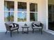 Outdoor patio seating with stylish chairs and a small table, perfect for relaxing at 3548 Cedarvale Ct, Powder Springs, GA 30127