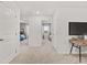 Bright hallway showcasing access to bedrooms, featuring neutral decor and plush carpeting at 4944 Jatoba Rd, Acworth, GA 30101