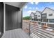 Balcony view of new construction townhomes with black and white exteriors and professional landscaping at 656 Soul Aly # 101, Alpharetta, GA 30009