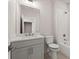 Well-lit bathroom with a classic tub, vanity and fixtures that create a serene experience at 656 Soul Aly # 101, Alpharetta, GA 30009