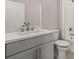 Modern bathroom with a sleek vanity, white countertop, and shower with white subway tile at 656 Soul Aly # 101, Alpharetta, GA 30009