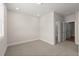 Inviting bedroom with plush carpeting and access to a bathroom, creating a comfortable retreat at 656 Soul Aly # 101, Alpharetta, GA 30009